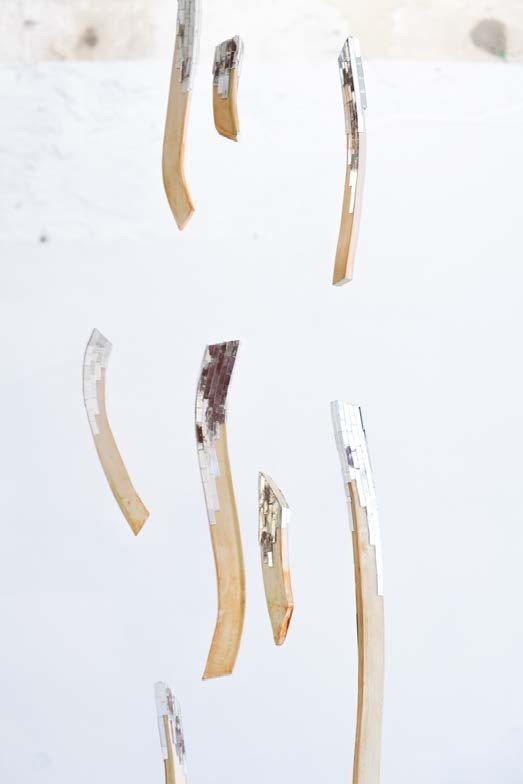 Ember (2026), ceramic torso on a plinth with suspended ceramic pieces carrying hand-cut mirror, view 4