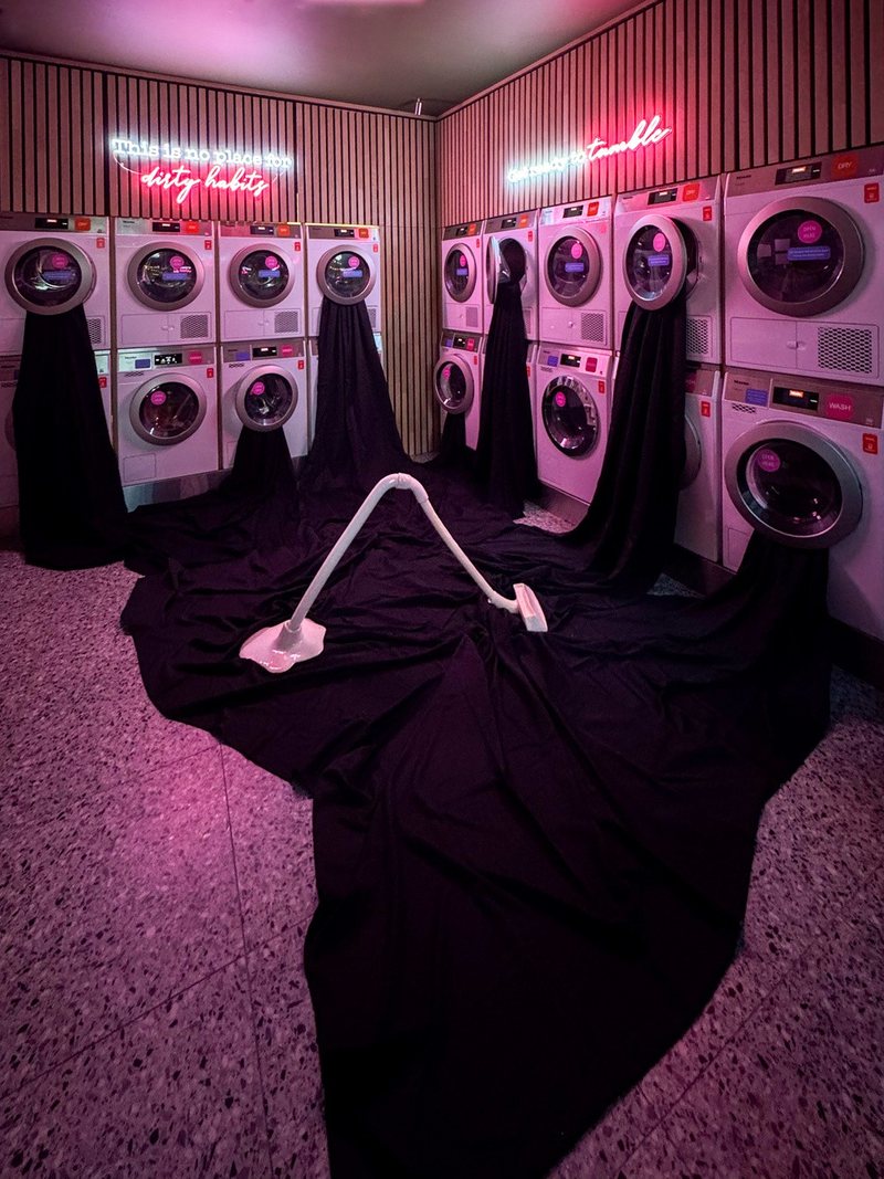 Swallow, 2026. Ceramic and fabric installation in the window of a laundrette in Bergen