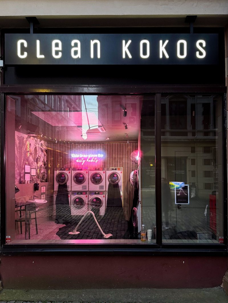 Swallow (2026), ceramic and fabric installation in the window of a laundrette in Bergen, view 2